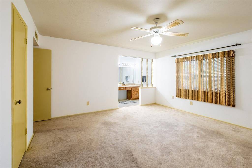 Another view of the primary bedroom.