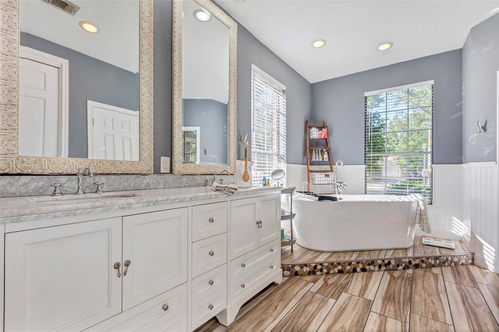 Spa -like Primary bath with beautiful custom tile work.