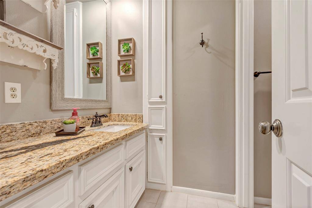 Secondary bath upstairs features a powder room with a separate tub/shower combo.