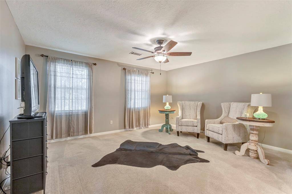 Secondary bedroom used as a sitting room- has attached ensuite bath and Texas basement.