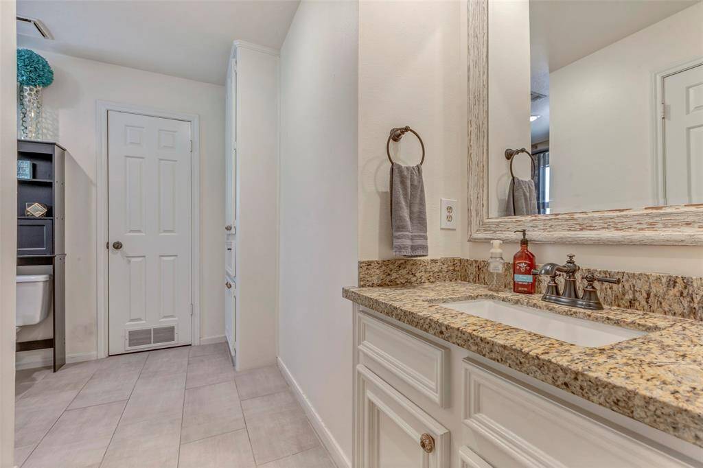 Ensuite bath and door to Texas Basement! Don't miss it.