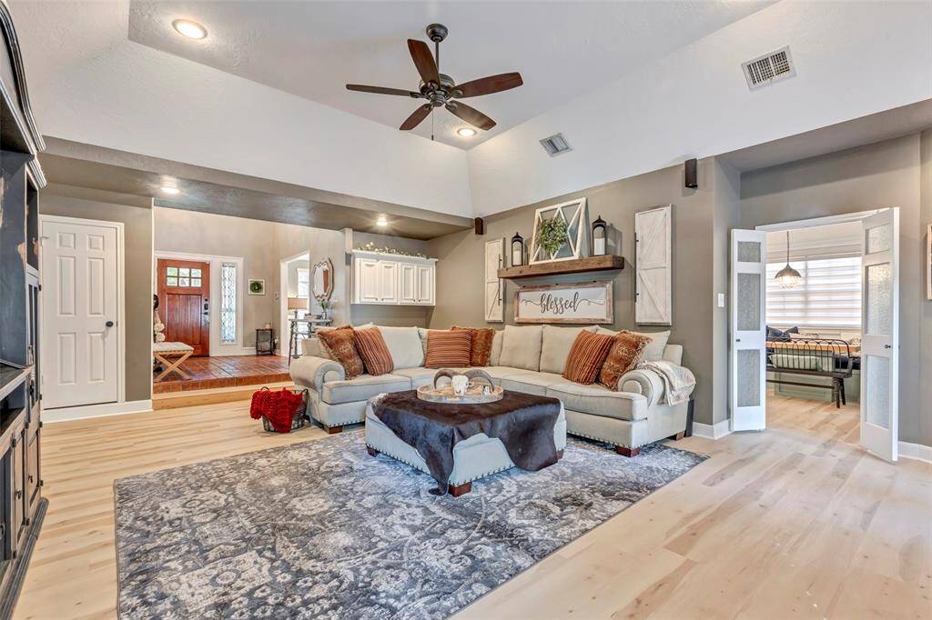 Notice the built-ins behind the sofa, door leads to breakfast room and kitchen.
