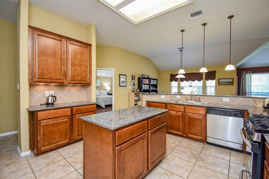 One view of the large Kitchen with plenty of cabinets for storage.