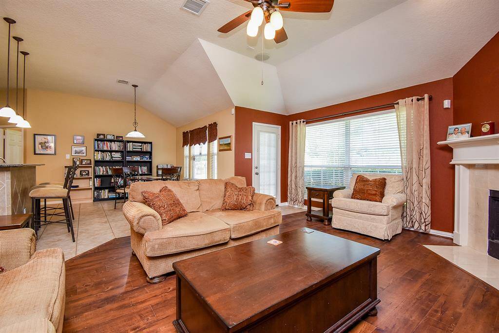 The Living room has beautiful Fireplace and gorgeous Floors