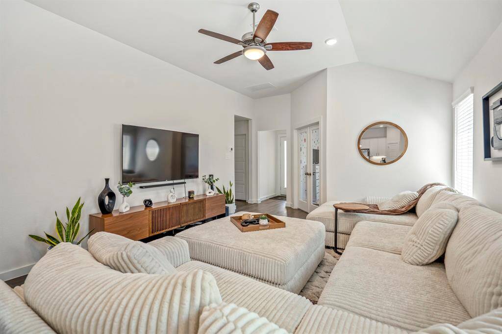 Just off the living room is the office, additional bedrooms and back door to the yard