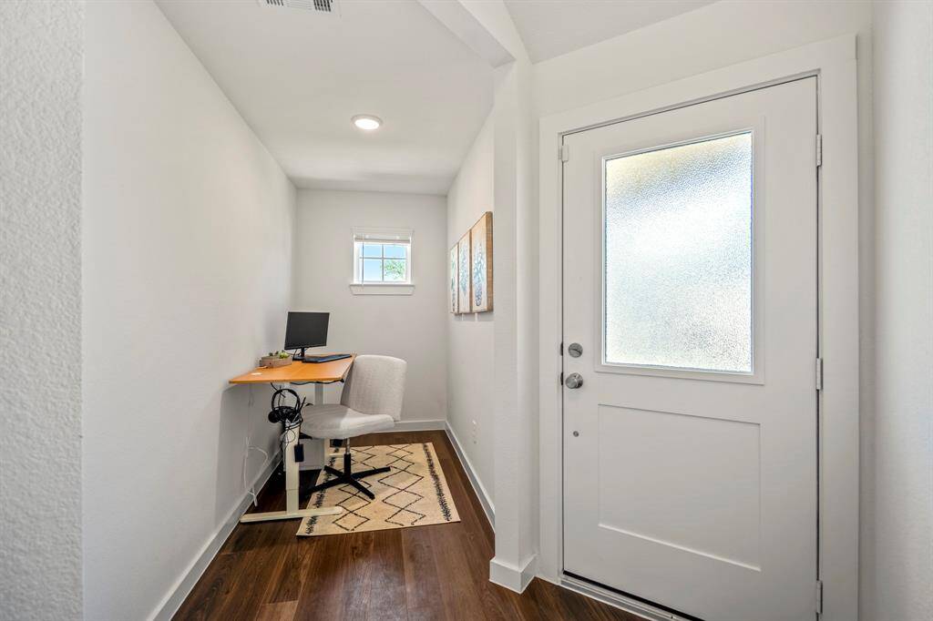 This pocket area off the entry can be used for anything but currently set up as an office
