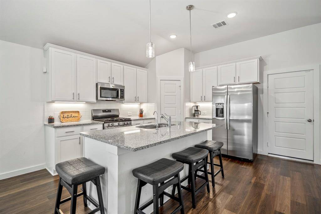 The kitchen with island and bar space for extra seating