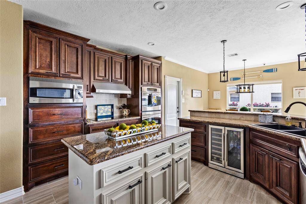Lots of cabinet space, including island storage. Updated pendant lighting as well.