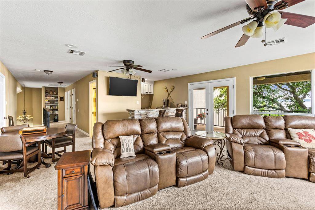 Game room with 2nd level covered patio access.