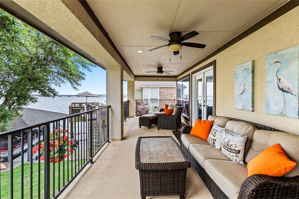 HUGE covered patio upstairs with endless views. Seller are leaving the patio furniture, ready for your first day at the lake!