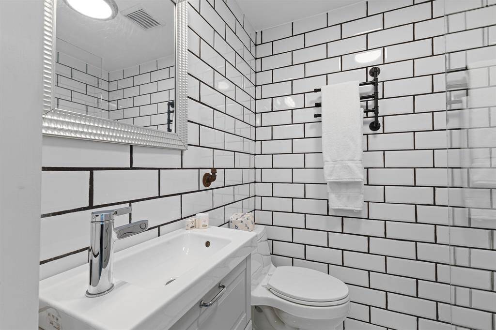Primary Bath with tile and glass walk-in shower