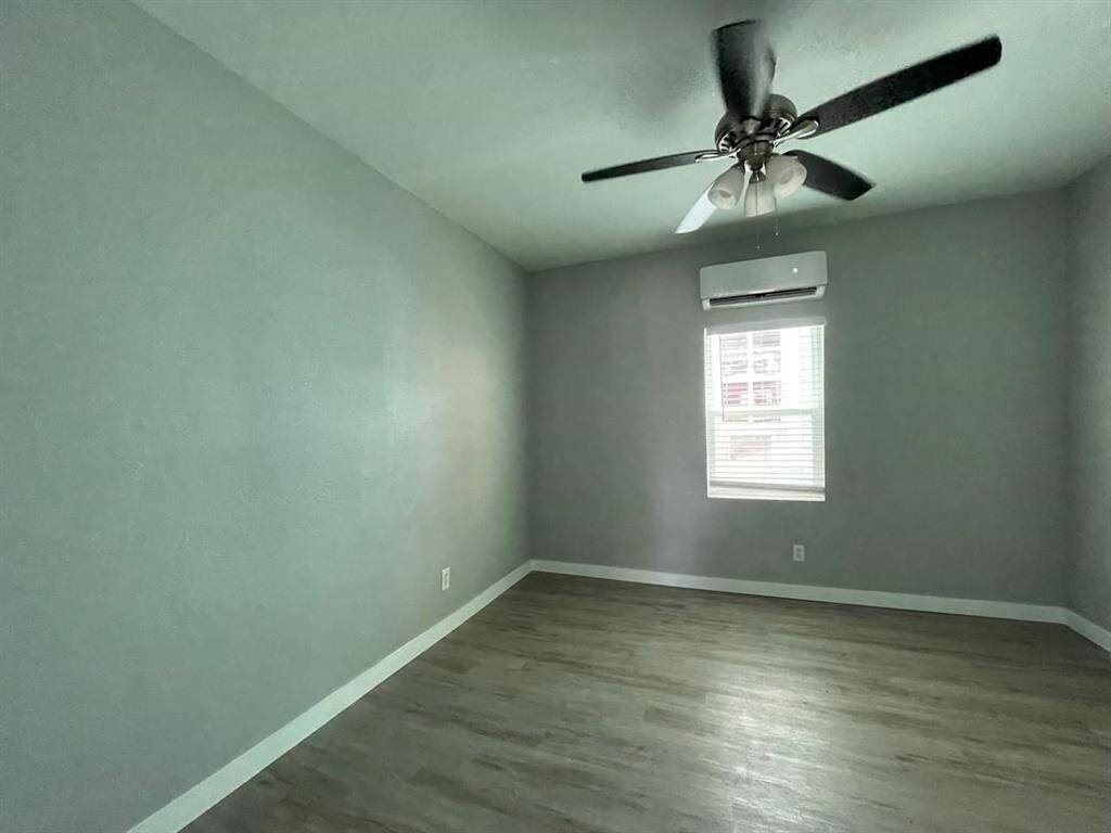 This bedrooms continue the clean aesthetic and split unit A/C for comfort and convenience.