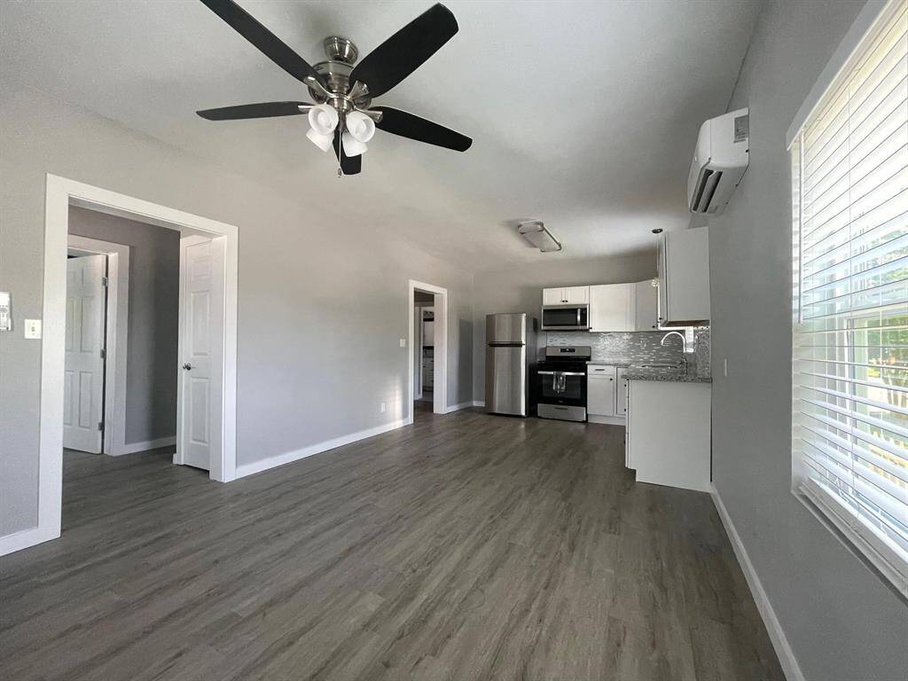 This open-concept living area flows seamlessly into the kitchen allowing for ample room to relax and entertain.