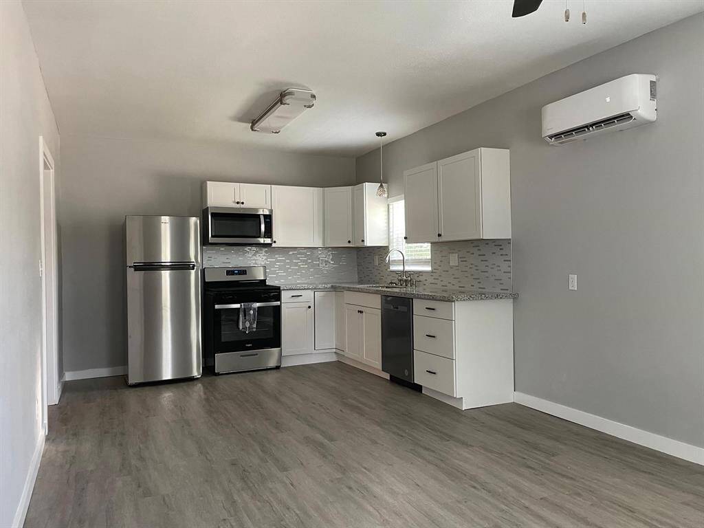 The kitchen continues a clean and simple-line aesthetic with modern finishes.