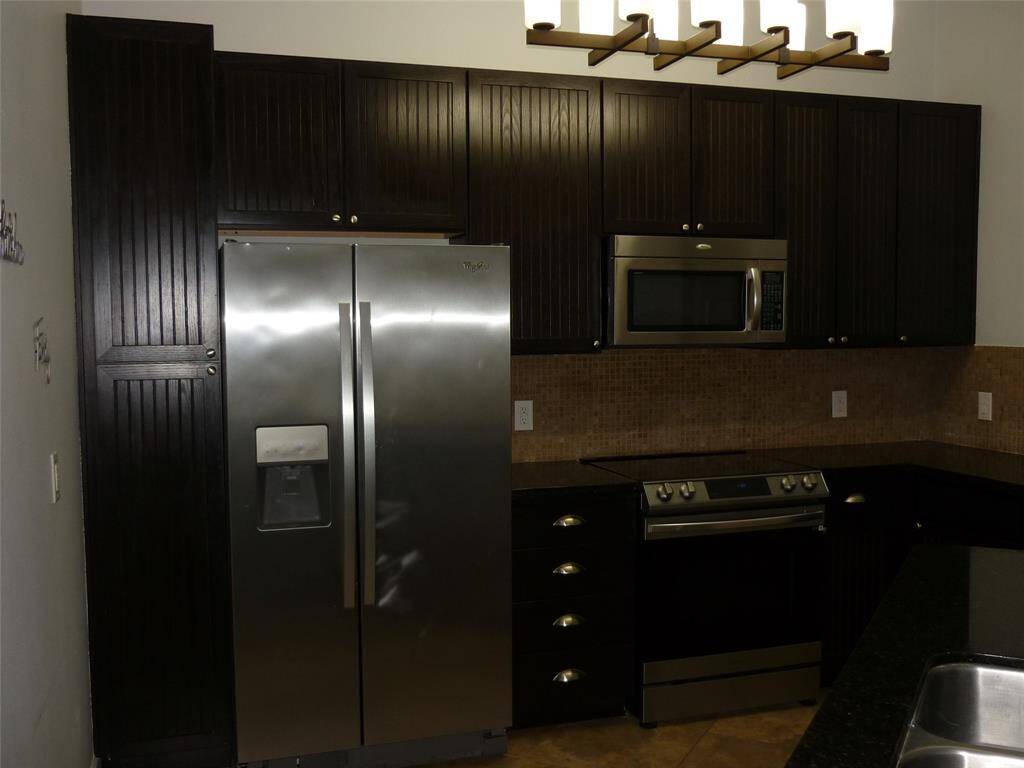 Fridge included. Glass cooktop