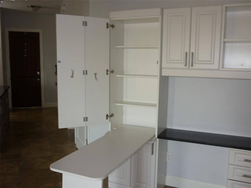 Cabinet opens to a desk or use as ironing board