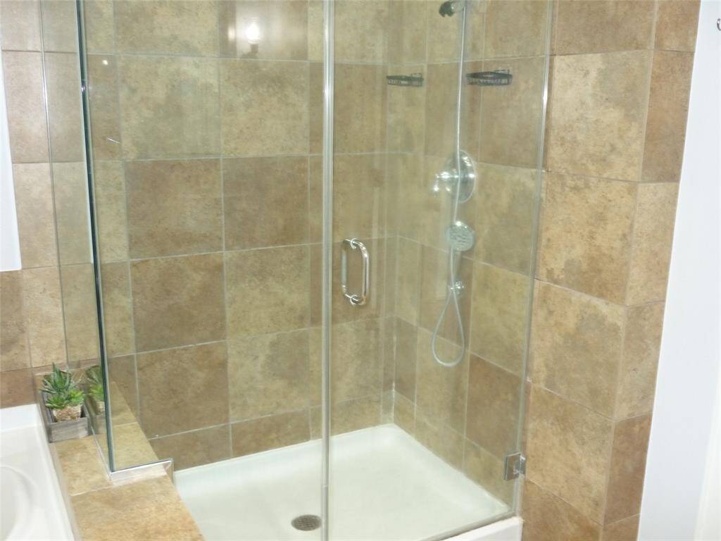 Shower is big enough for two with two shower heads