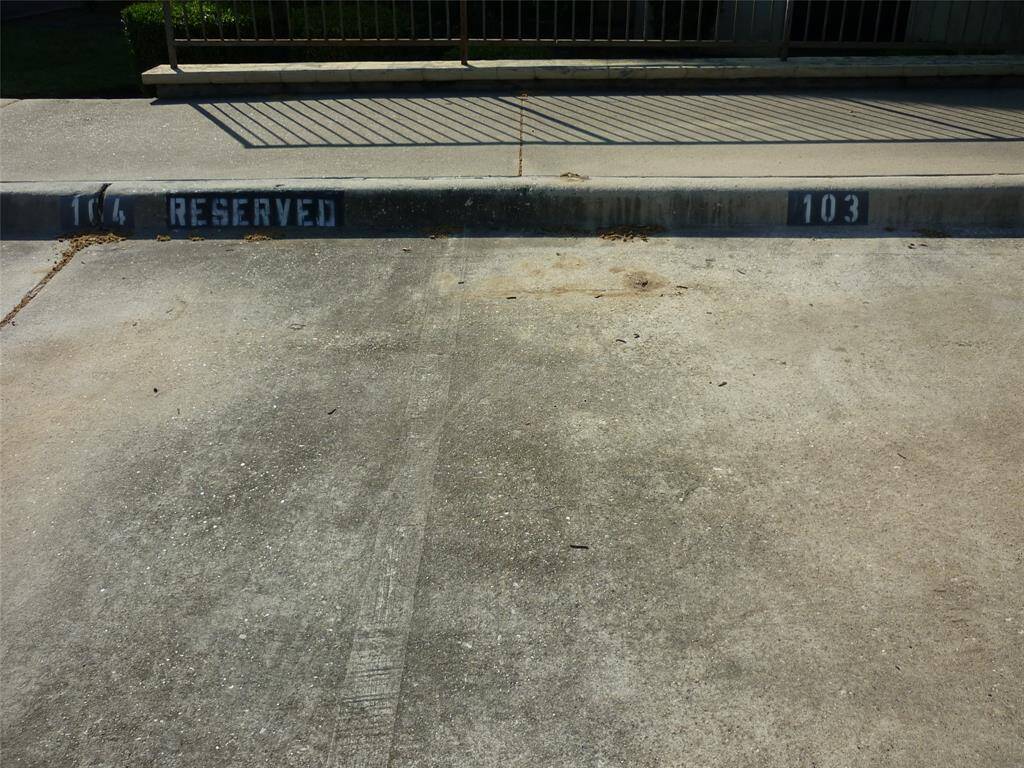 Two designated parking slots near the stairs