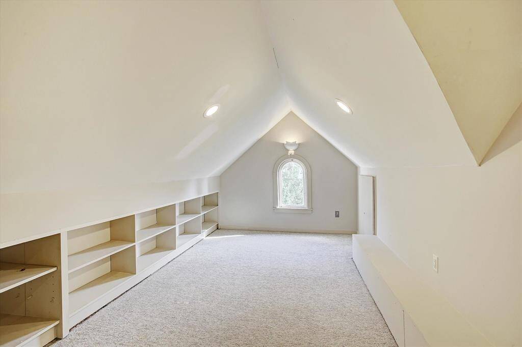 Upper unit study with built-is is attached and open to the primary bedroom.