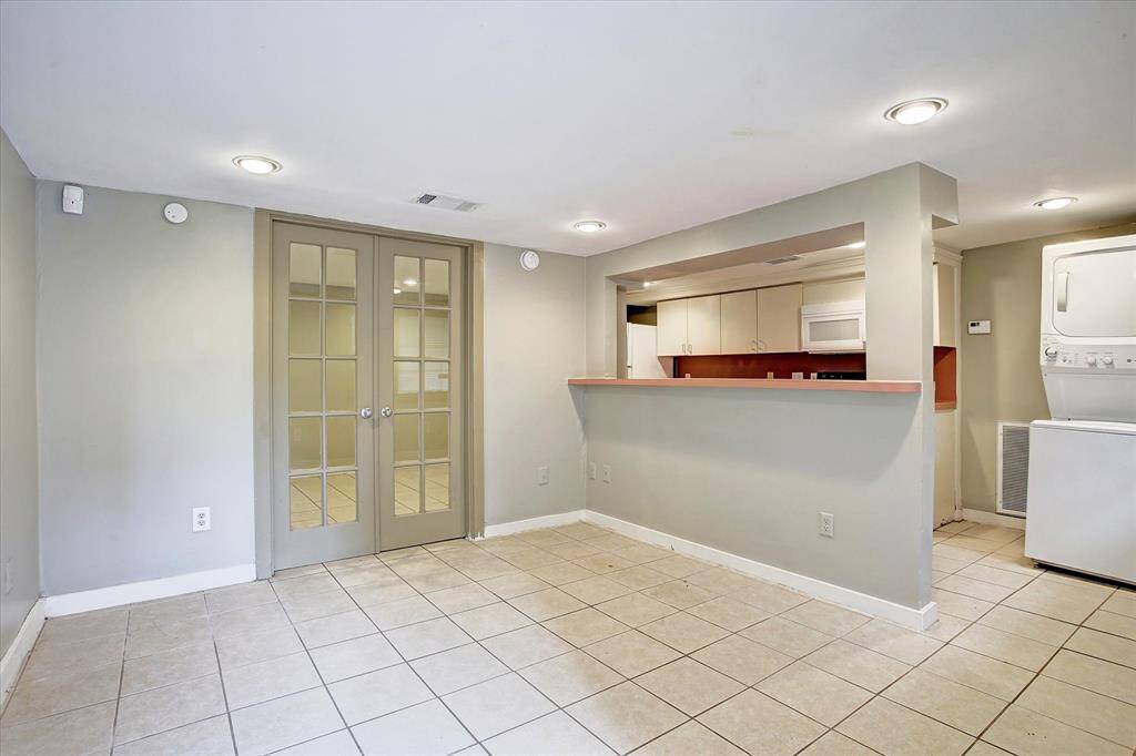 Carriage house kitchen  and living area. French doors lead to study.