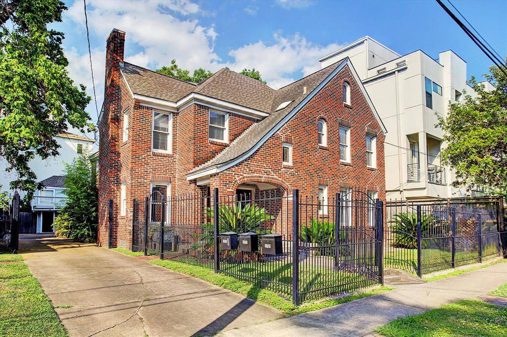Charming 1930's duplex with 2-story carriage house in back.