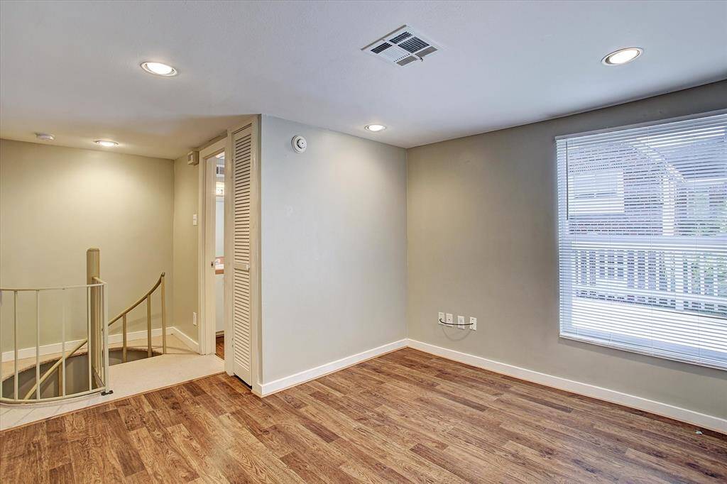 Spiral staircase bedroom on 2nd floor of carriage house.