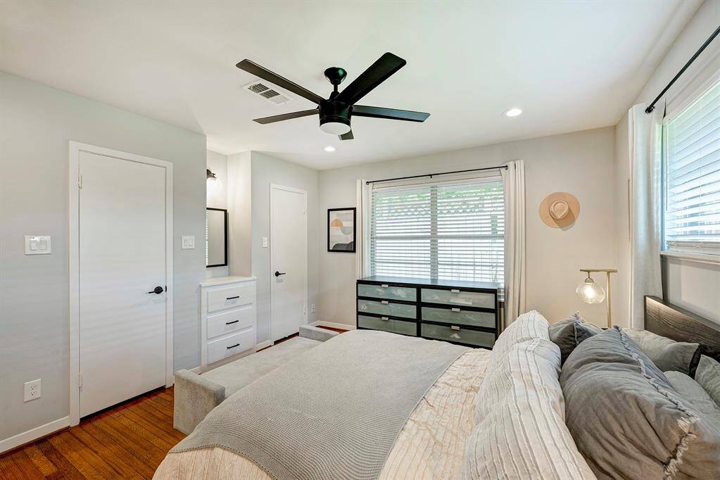 Another look at the primary bedroom with nice natural light and vanity area.