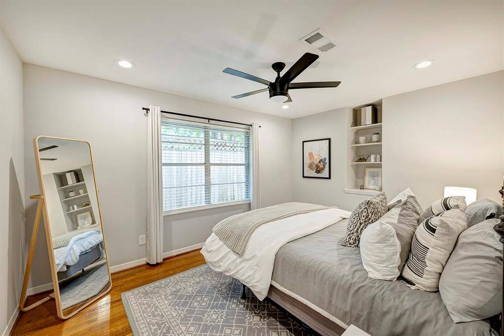 One of 2 secondary bedrooms. Both with hardwood floors, window blinds, recessed lighting and ceiling fan.