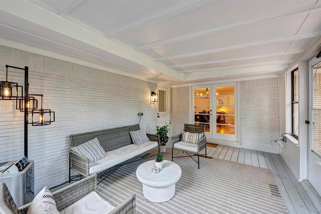 Fabulous sunroom is bonus living space. Efficient air-conditioning floor unit cools the room that overlooks the backyard.