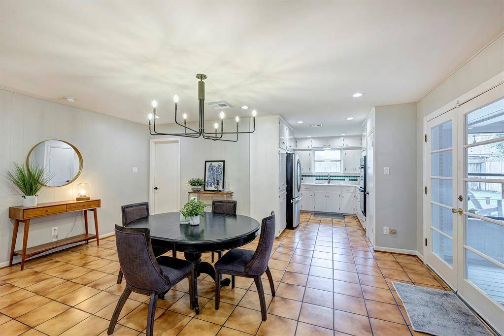 Sunroom is to the right with kitchen straight ahead.
