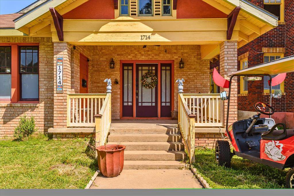 Entry into this charming 1921 Craftsman Brick property!