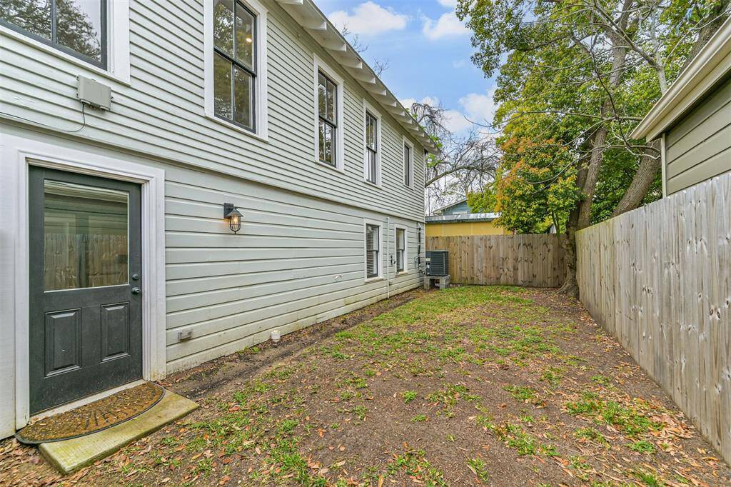 Side yard #2, accessible from front fence or through door in downstair living area.