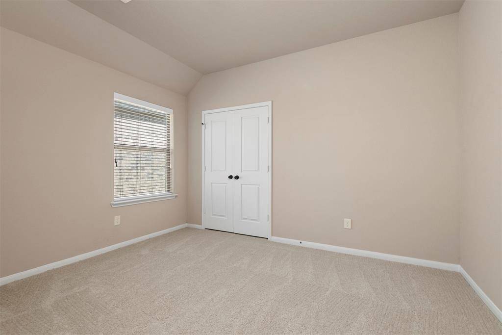 Bedroom #3 up with tall ceiling and walk in closet.