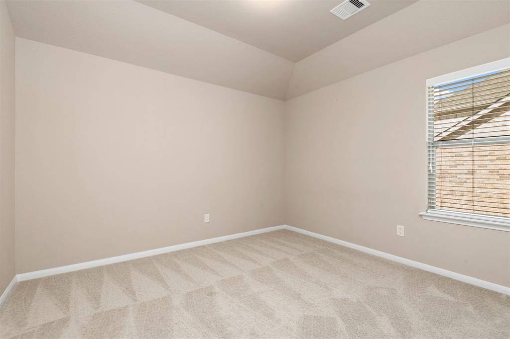 Bedroom #4 up with vaulted ceiling and walk in closet.