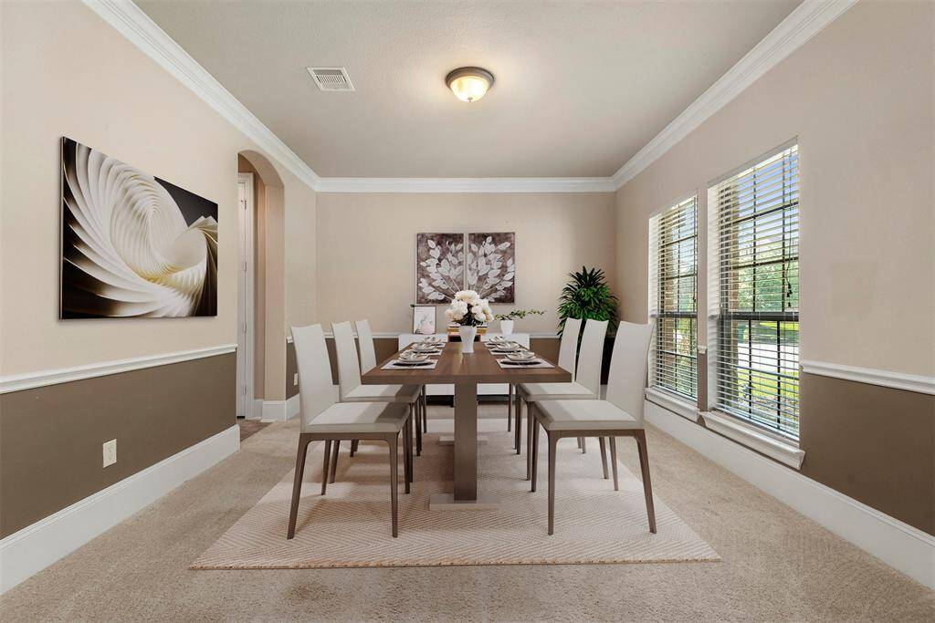 Flex room staged as a formal dining room. This room would also be a great craft room, playroom, home gym....whatever your need. Virtually staged.