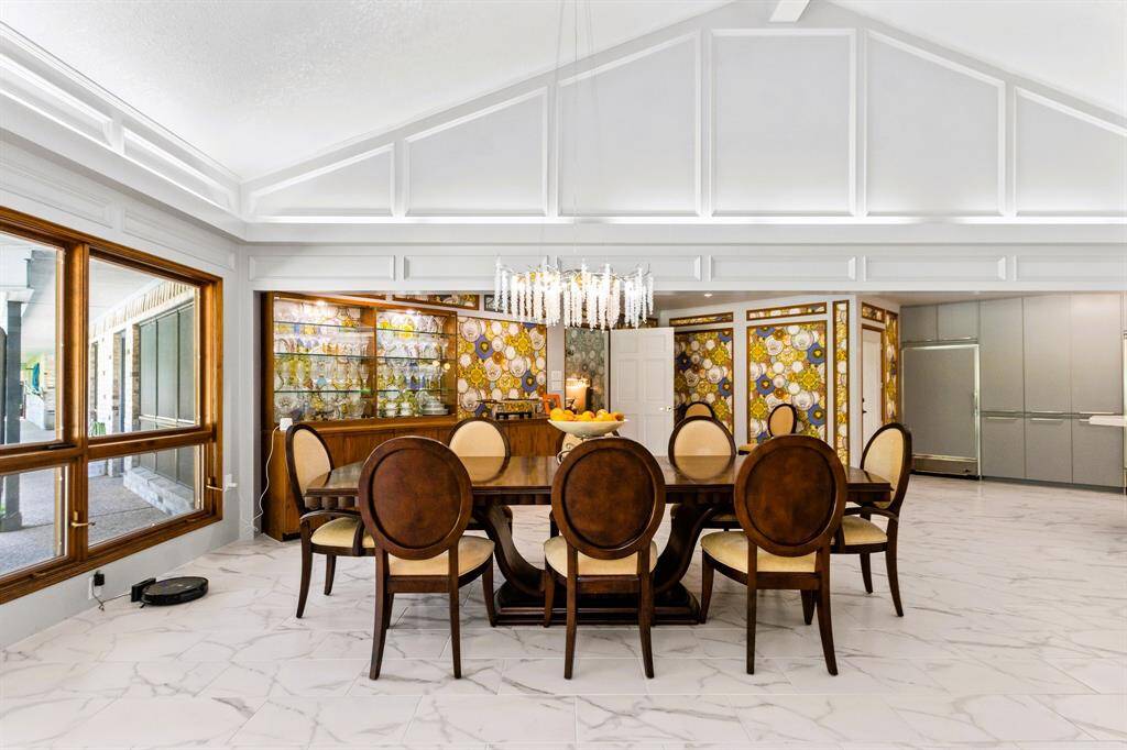 The dining room exudes elegance with its refined ambiance, perfect for hosting unforgettable gatherings.