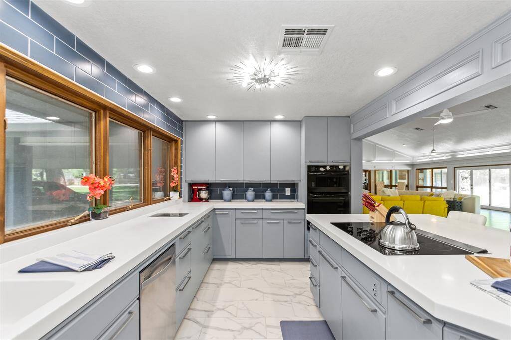 The kitchen offers an expansive layout, providing plenty of room for both cooking and entertaining.