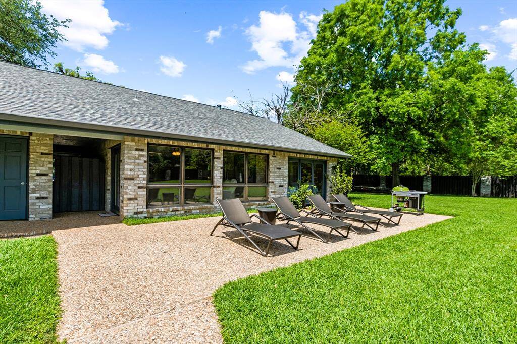 Relax and sunbathe by the pool, soaking up the warmth and enjoying the peaceful surroundings of the spacious, fenced backyard.