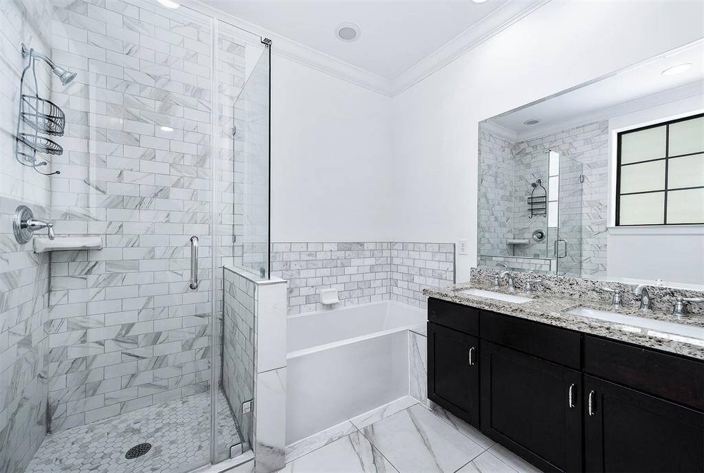 Large Steam Shower And Dual Sinks.