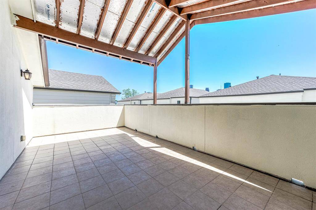 Covered Rooftop Deck With Downtown Views.