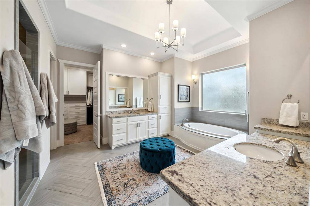With dual vanities, designer updates, a luxurious soaking tub, a seamless glass shower, and a convenient coffee bar with a built-in fridge, this spa-like retreat will make you feel like you're in a 5-star hotel every day.