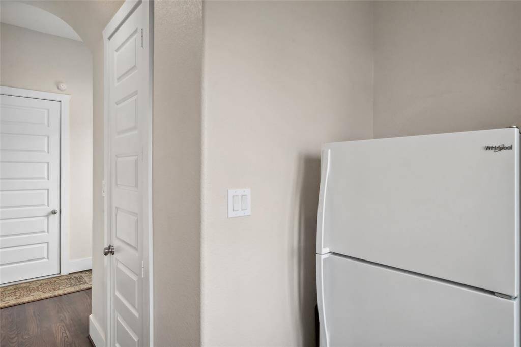 Here’s a view of the mudroom, conveniently located right off the garage. To the far left, you’ll find the garage entry, followed by the mudroom area for easy organization. The walk-in pantry is accessible through the middle door, and an additional storage room provides even more space. This home offers an abundance of storage to keep everything neatly tucked away!