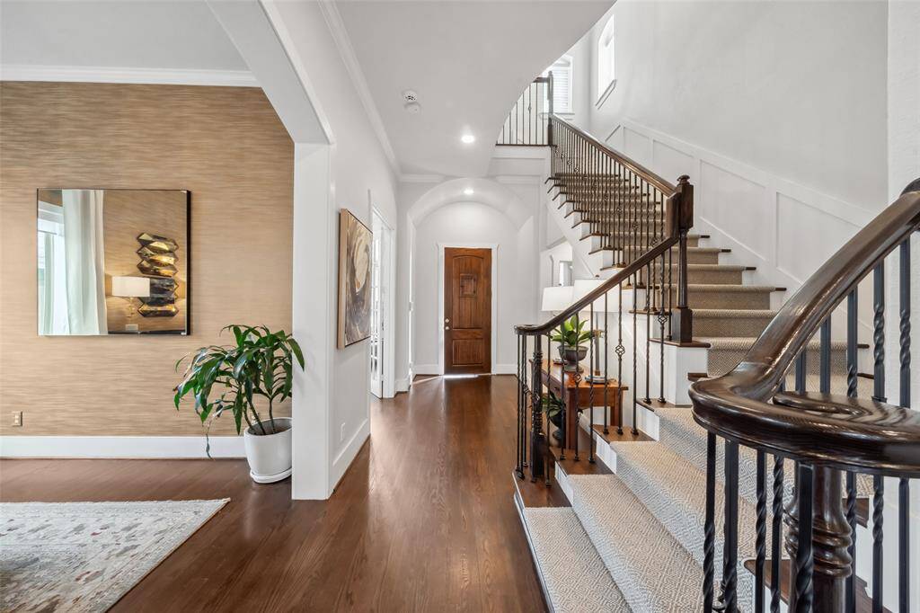 This home exudes an exquisite, warm ambiance with its rich solid wood floors and carefully curated designer touches, creating a perfect blend of elegance and comfort.