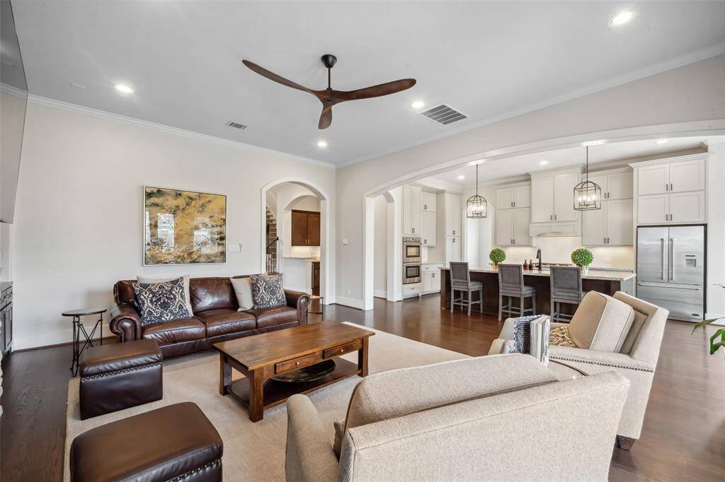 The first floor showcases exquisite details throughout, featuring a stylish half bath, a convenient butler's pantry, an elegant dining room, and a dedicated office. The open-concept chef’s kitchen boasts high-end appliances and a spacious walk-in pantry, while the adjacent mudroom and extra storage room provide added functionality and organization.