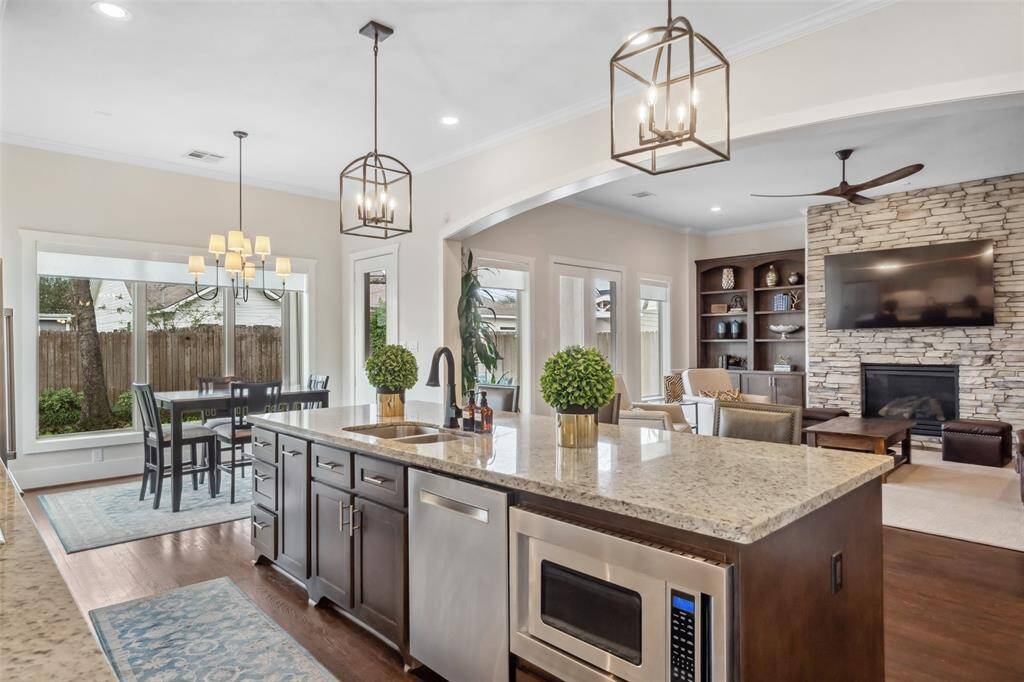 We LOVE this massive island, thoughtfully designed with a built-in undermount sink, dishwasher, and a drawer-style microwave. Perfect for meal prep, casual dining, and entertaining, this centerpiece of the kitchen combines both functionality and style!