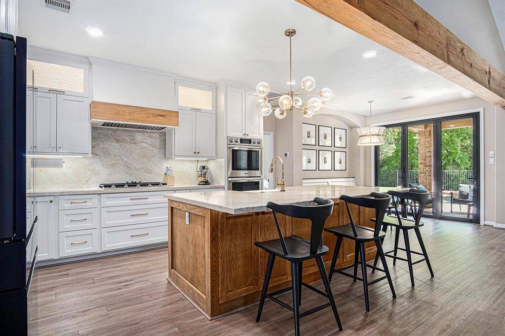 Imagine being able to help with homework while cooking dinner at this oversized designer island!