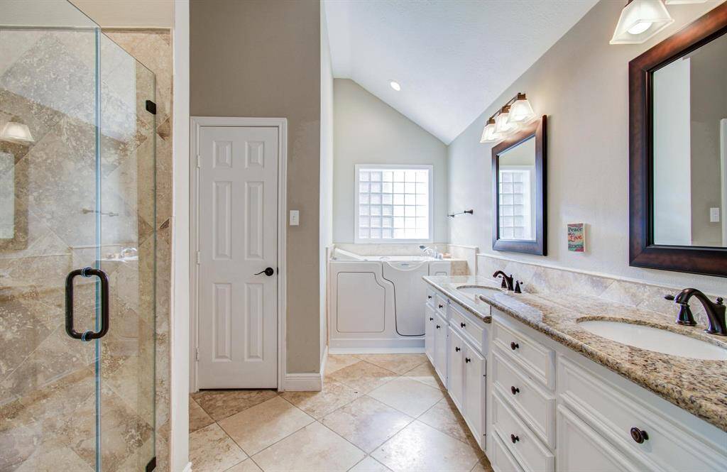 Primary ensuite boasts dual sinks, walk in shower, walk in jetted tub, separate water closet and large walk in closet!