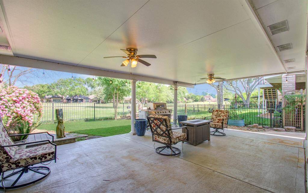 Unwind in your backyard oasis under the expansive covered patio while enjoying the spectacular view of the golf course.