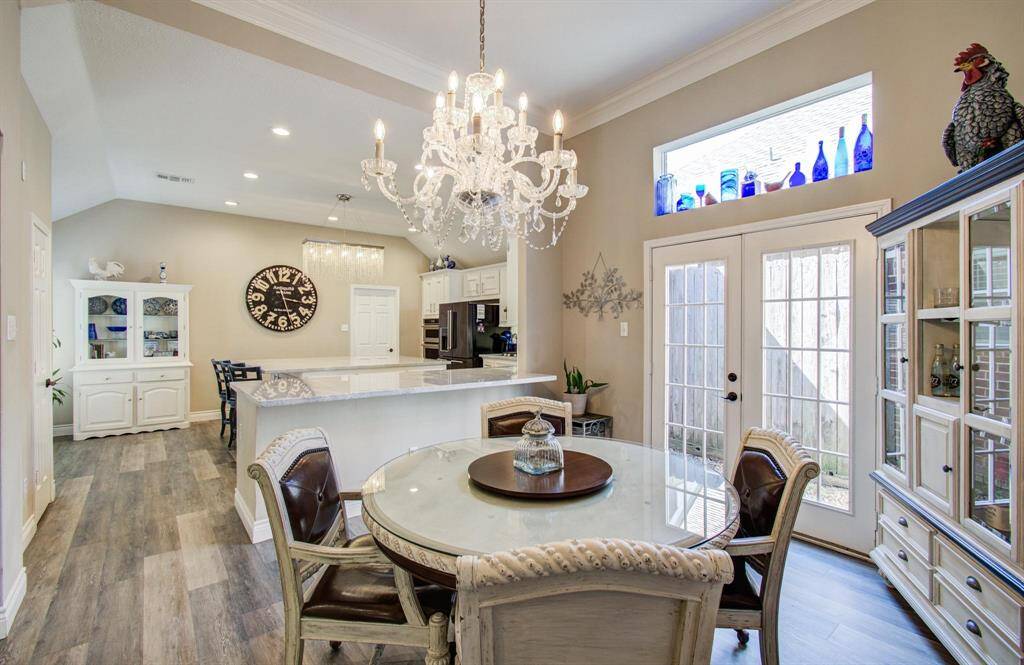Dining/breakfast room adjoins the kitchen.  Private serene atrium thru the french doors.