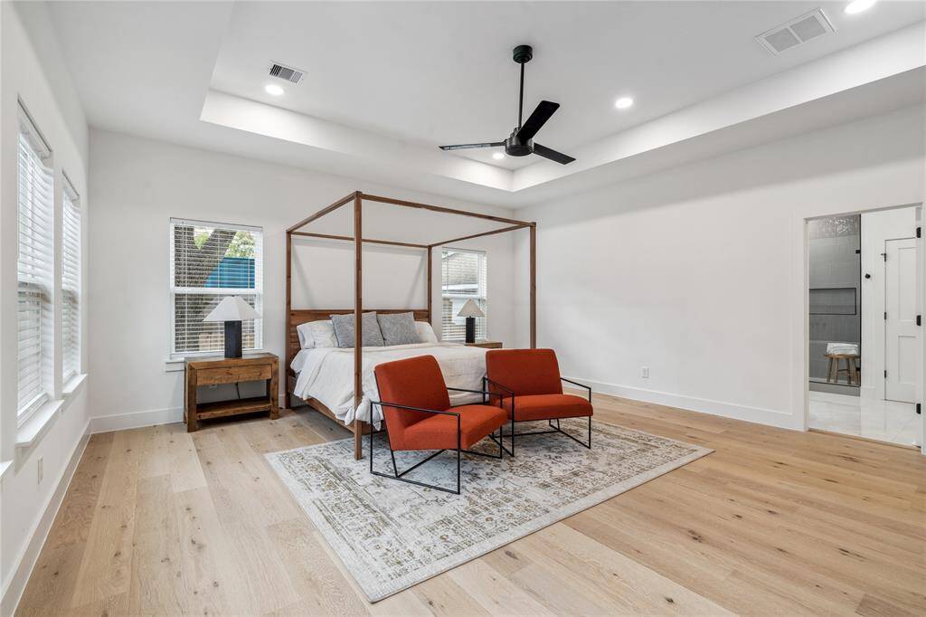Numerous windows can be found in this primary bedroom which provides plenty of natural light.